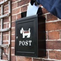 Posting a letter into the "White Westie" Post Box 