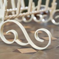 Close up of Cream Wrought Iron Scrollwork 