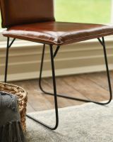 Contemporary Tan Leather and Black Steel Chair Leg Close Up