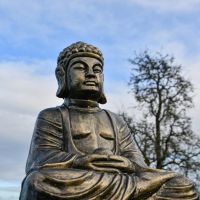 Antique Gold Buddha Sculpture in Garden 