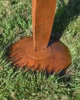 Close-up of the Round Metal Base on the Flower Sculpture