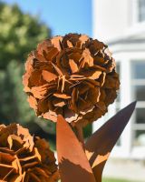 Close-up of the Round Rustic Flowers on the Sculpture
