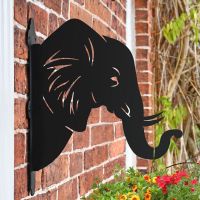 Elephant Trunk Hanging Basket Bracket Mounted to a Brick Wall