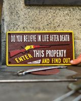 Scale image of cast iron wall sign
