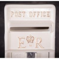 Close-up of the Gold Tact on the Front of the Post Box