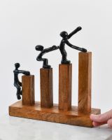 Scale image of cast aluminium and mango wood interior ornament