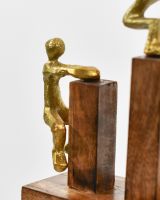 Close up of gold cast aluminium figures on home decor sculpture