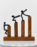 Front view of cast aluminium and mango wood home decor sculpture