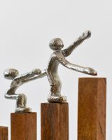 Close up of cast aluminium silver figures on home decor ornament