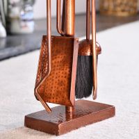 Close up of Antique Copper Hammered Companion Set 