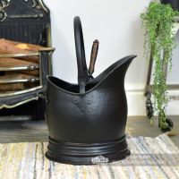 Side View of the Black Traditional Coal Bucket With Shovel