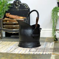 Black Traditional Coal Bucket With Shovel in Situ Next to the Fireplace