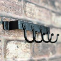 View of the hooks on the Fireside Tool Rack
