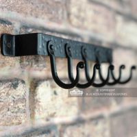 View of the hooks on the Fireside Tool Rack