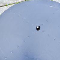 Close up of steel lid and ball handle