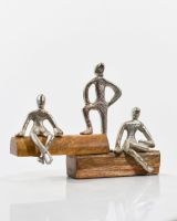 Angled view of cast aluminium and mango wood interior ornament