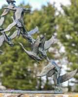 Close up of Flock of Flying Ducks Garden Sculpture 