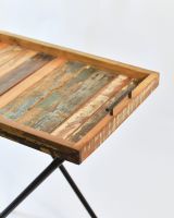 Close up if rustic top detail on reclaimed wood folding table