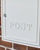 Close-Up of "POST" Lettering in Matching Cream Finish