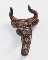 Front view of intricately detailed copper coat hook