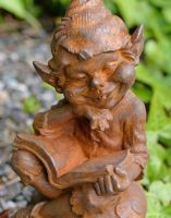 Close-up of Cast Iron Cheeky Elf Sculpture