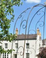 Close up of curved top and intricate scrollwork detail on gazebo