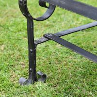Black Two Seater Park Bench Feet Close-Up