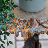 Close up of rustic finish on vintage gothic side table