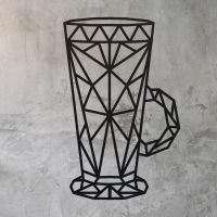 Geometric Steel Latte Glass Wall Art on a Rustic Wall