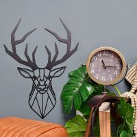 Geometric Stag Steel Wall Art in Situ Next to a Floor Standing Clock