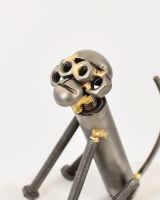 Close up of intricate face detail on scrap metal art sculpture