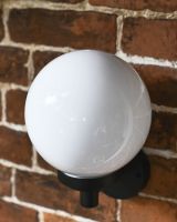 Close-up of the White Globe on the Top of the Wall Light