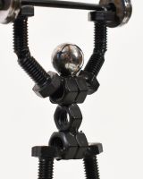 Close up of intricate figure detail on scrap metal art sculpture