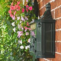 Side View of the Wall Mounted Post Box Mounted on a Brick Wall