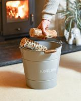 Scale Shot Of Grey "Kindling" Log Store Bucket