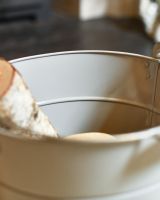 Close Up Of Grey "Kindling" Log Store Bucket Internal Storage