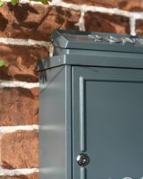 Close-Up of Squared Design on Wall-Mounted Post box