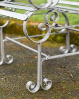 Close Up Of Scrolled Bench Legs 