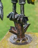 Close up of feet detail on scrap metal art sculpture