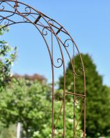 Close up of intricate scrollwork detail on rose arch