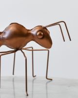 Close up of intricate head detail on recycled metal art