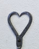 Close up of heart detail on coat hook
