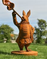 scale image of rustic cast iron garden statue