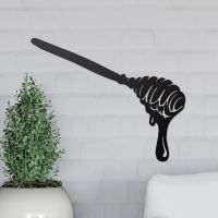 Honey Spoon Wall Art on the Wall Next to Plants
