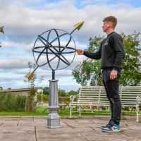 "Millennium Globe" Armillary with male for scale 