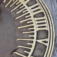 Close up of roman numerals on sundial 