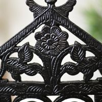 Close up of floral detail on umbrella stand