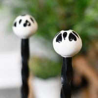 Detailed image of hand painted ceramic finial on welly rack