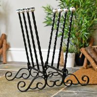 Side view of hand crafted twist and scroll boot rack