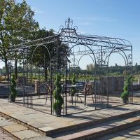 Black garden pavilion on patio